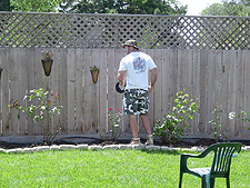 Dave installing drip system for roses.
